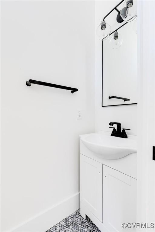 bathroom with tile patterned flooring and vanity