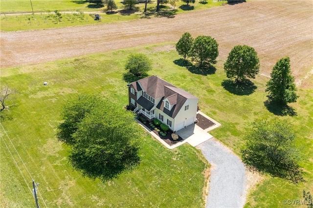 birds eye view of property with a rural view