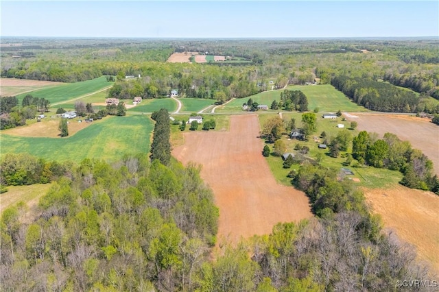 aerial view featuring a wooded view