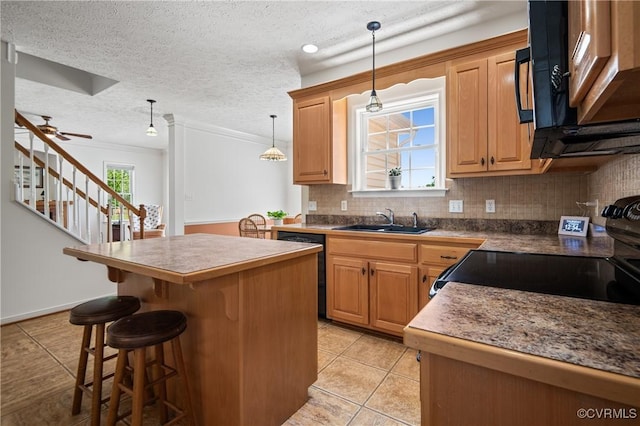 kitchen with light tile patterned flooring, tasteful backsplash, a center island, and a sink