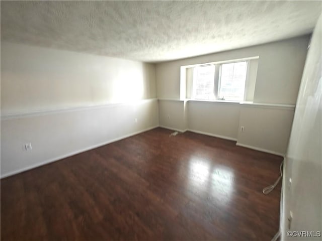 7701 Okeith Ct Unit 1601, Henrico, VA 23228 - empty room with a textured ceiling and wood finished floors