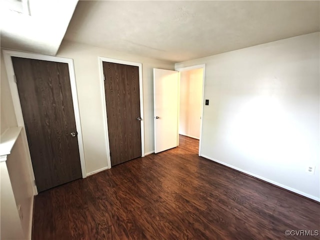 7701 Okeith Ct Unit 1601, Henrico, VA 23228 - unfurnished bedroom featuring wood finished floors and baseboards