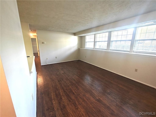 7701 Okeith Ct Unit 1601, Henrico, VA 23228 - empty room featuring dark wood-style floors and a textured ceiling