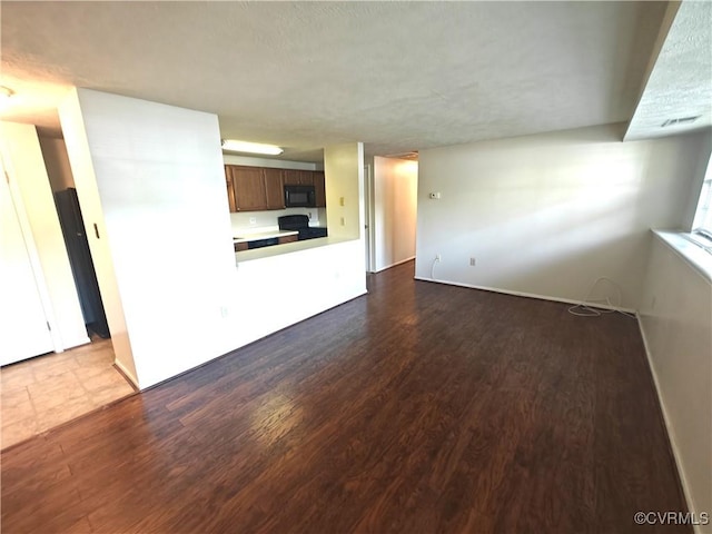 7701 Okeith Ct Unit 1601, Henrico, VA 23228 - unfurnished living room with dark wood finished floors and baseboards