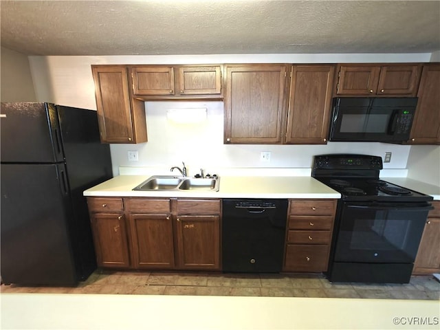 7701 Okeith Ct Unit 1601, Henrico, VA 23228 - kitchen featuring black appliances, light countertops, and a textured ceiling