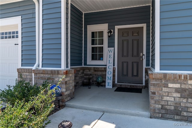 property entrance with stone siding and covered porch