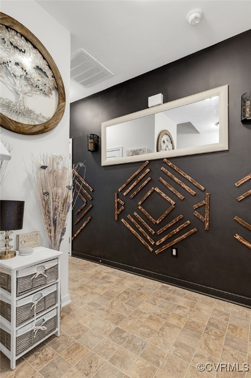 interior space with visible vents and baseboards