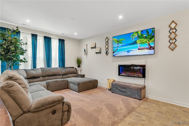 living room featuring visible vents, baseboards, and recessed lighting