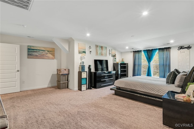 carpeted bedroom with visible vents, baseboards, and recessed lighting