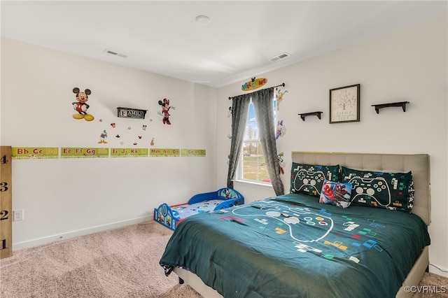 carpeted bedroom featuring baseboards and visible vents