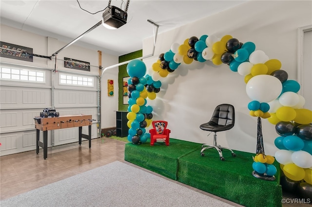 recreation room with a garage
