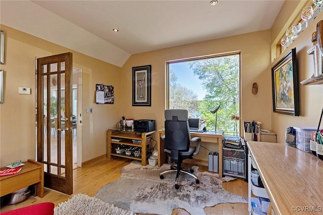 office with baseboards, french doors, light wood-type flooring, and lofted ceiling