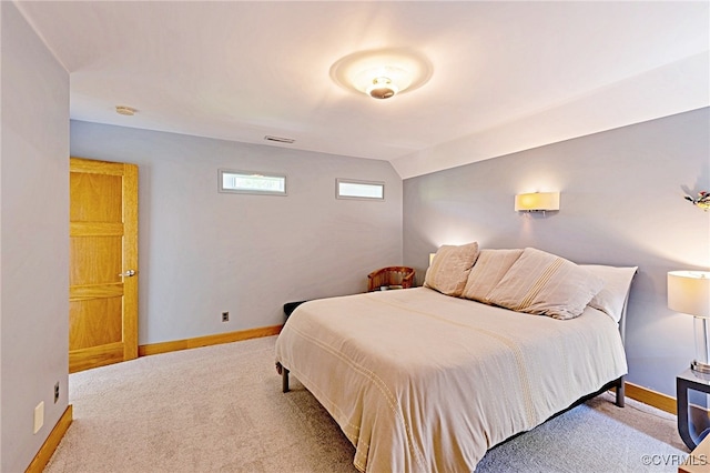 carpeted bedroom featuring baseboards