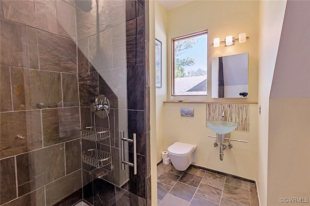 full bathroom with toilet and tiled shower