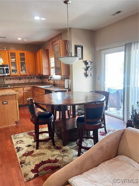 502 Peafowl Ct, Suffolk, VA 23435 - dining space featuring dark wood-type flooring and recessed lighting