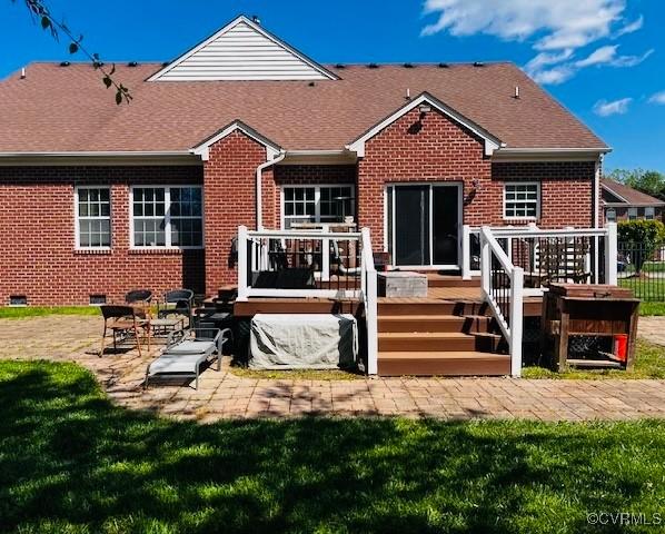 502 Peafowl Ct, Suffolk, VA 23435 - back of property with brick siding, a patio, a wooden deck, a shingled roof, and crawl space