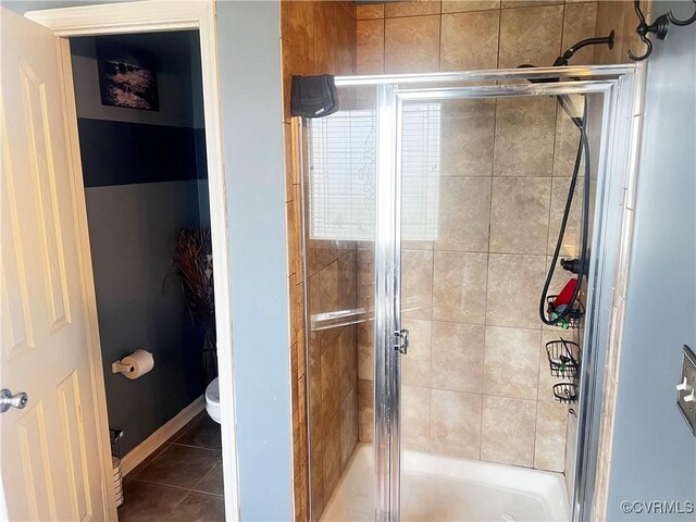 502 Peafowl Ct, Suffolk, VA 23435 - bathroom featuring a stall shower, tile patterned floors, and toilet
