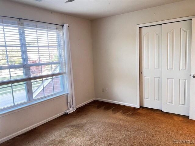 502 Peafowl Ct, Suffolk, VA 23435 - unfurnished bedroom featuring carpet flooring, baseboards, and a closet