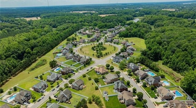 502 Peafowl Ct, Suffolk, VA 23435 - aerial view of residential area featuring a forest
