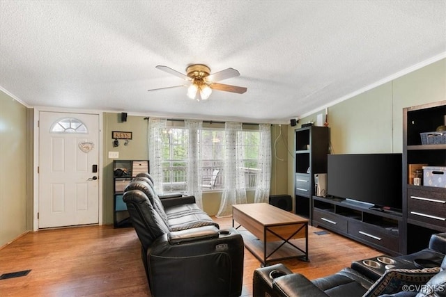 10340 Swift Rd, Partlow, VA 22534 - living room with ornamental molding, ceiling fan, a textured ceiling, and wood finished floors