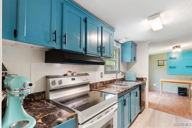 10340 Swift Rd, Partlow, VA 22534 - kitchen with under cabinet range hood, range with electric stovetop, blue cabinetry, a sink, and dark countertops