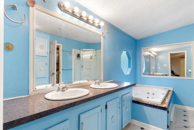 10340 Swift Rd, Partlow, VA 22534 - bathroom featuring a textured ceiling, a shower stall, tile patterned floors, a jetted tub, and double vanity