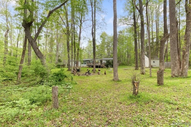 10340 Swift Rd, Partlow, VA 22534 - view of green lawn featuring an outdoor structure and a forest view