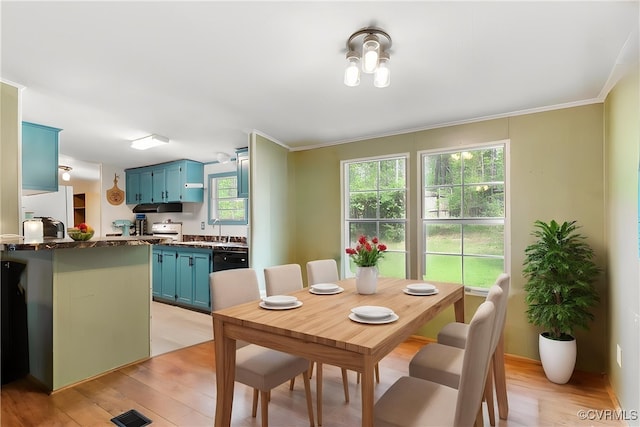 10340 Swift Rd, Partlow, VA 22534 - dining space featuring light wood finished floors and crown molding