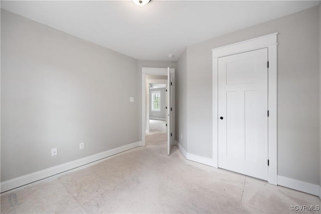 unfurnished bedroom with baseboards