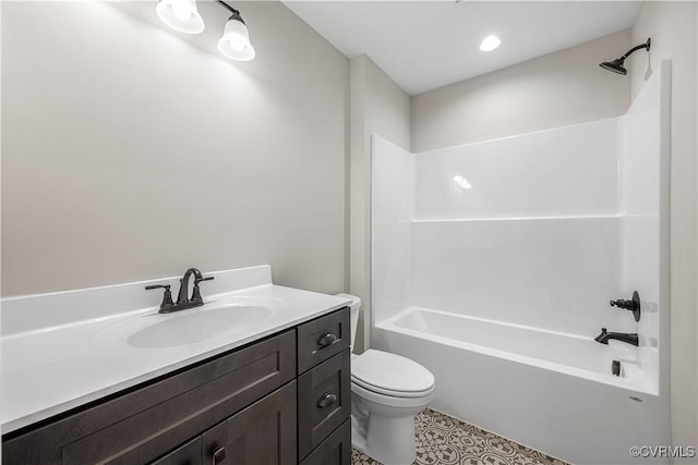 full bathroom with tile patterned flooring, vanity, bathtub / shower combination, and toilet