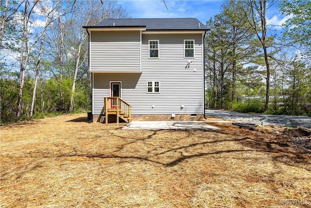 rear view of house featuring crawl space