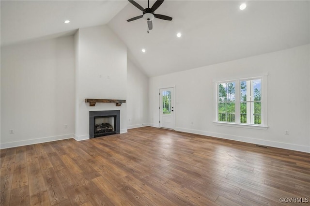 unfurnished living room with wood-type flooring, a fireplace, a ceiling fan, and recessed lighting