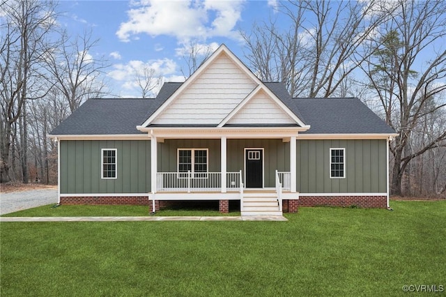 view of front of house featuring a porch, roof with shingles, board and batten siding, and a front yard