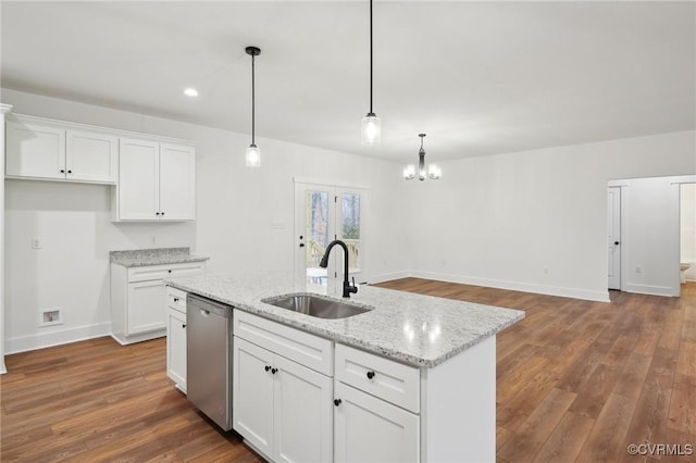 kitchen with a chandelier, dishwasher, a sink, and white cabinetry