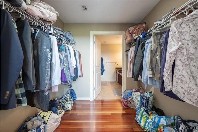 1101 Haxall Pt Unit U810, Richmond, VA 23219 - walk in closet featuring wood finished floors