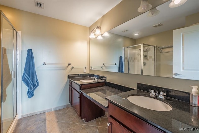 1101 Haxall Pt Unit U810, Richmond, VA 23219 - bathroom with double vanity, a stall shower, and tile patterned flooring