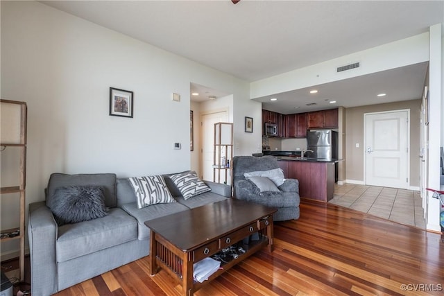 1101 Haxall Pt Unit U810, Richmond, VA 23219 - living room featuring wood finished floors and recessed lighting