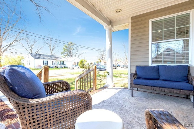 view of patio with outdoor lounge area and a porch