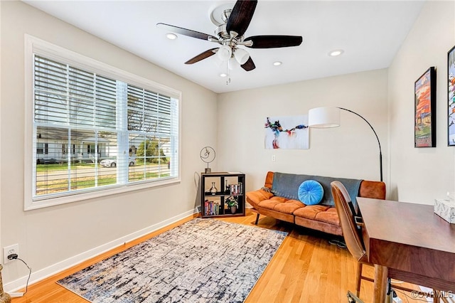 sitting room with recessed lighting, wood finished floors, baseboards, and ceiling fan