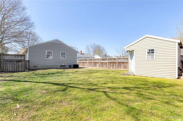 view of yard with fence and cooling unit