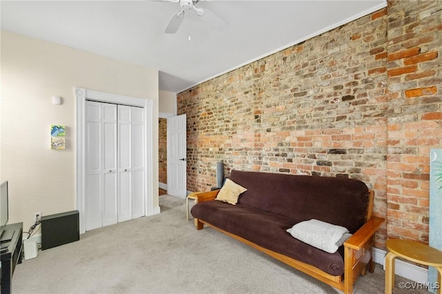 116 N 29th St, Richmond, VA 23223 - sitting room with a ceiling fan, carpet floors, and brick wall
