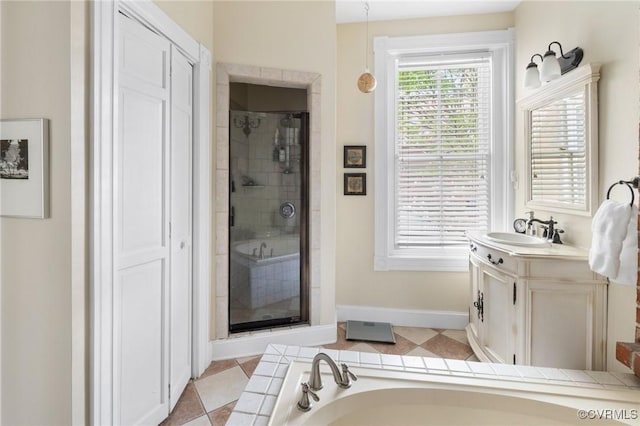 116 N 29th St, Richmond, VA 23223 - bathroom with a shower stall, vanity, and baseboards