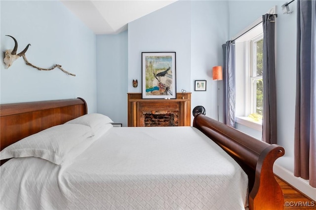 116 N 29th St, Richmond, VA 23223 - bedroom with wood finished floors and vaulted ceiling