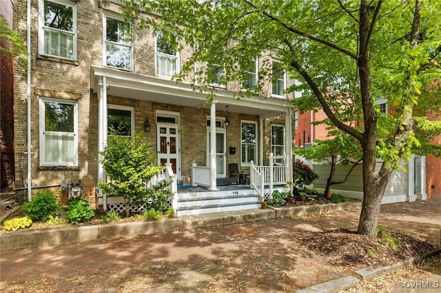 116 N 29th St, Richmond, VA 23223 - entrance to property with a porch and brick siding