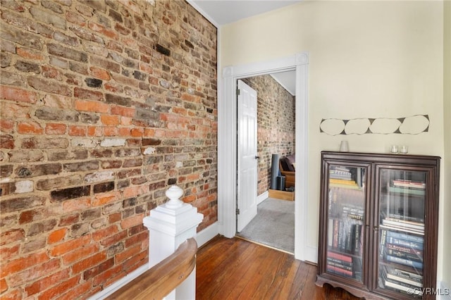 116 N 29th St, Richmond, VA 23223 - hallway with dark wood-type flooring, baseboards, and brick wall