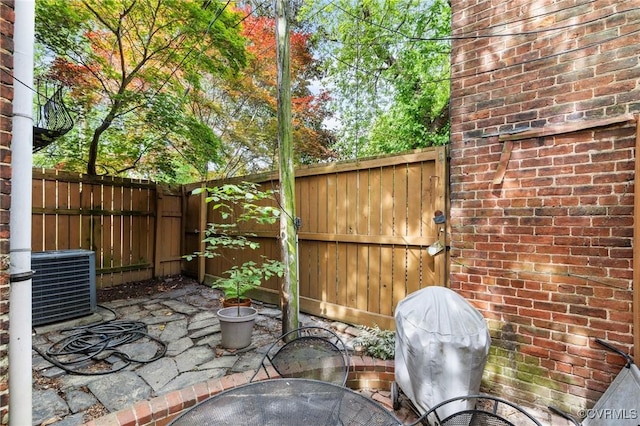 116 N 29th St, Richmond, VA 23223 - view of patio featuring central AC, fence private yard, and a gate