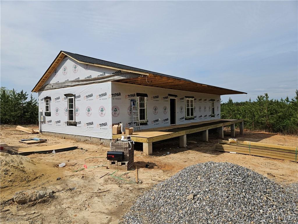 view of front of home with a wooden deck