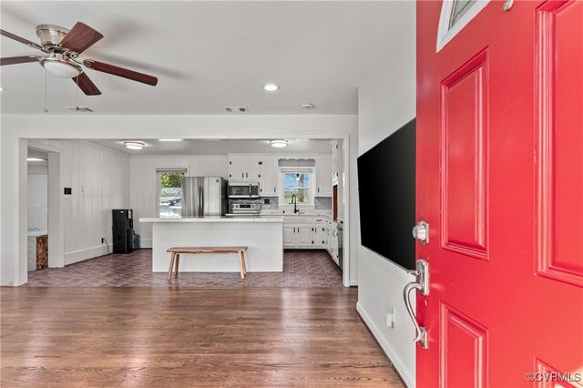 2230 Lancers Blvd, Chesterfield, VA 23224 - unfurnished living room featuring ceiling fan, dark wood finished floors, healthy amount of natural light, recessed lighting, and a sink