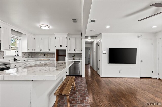 2230 Lancers Blvd, Chesterfield, VA 23224 - kitchen with backsplash, white cabinetry, appliances with stainless steel finishes, a ceiling fan, and a sink