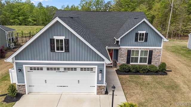 8106 W Danube Loop, New Kent, VA 23124 - view of front facade with stone siding, board and batten siding, and driveway